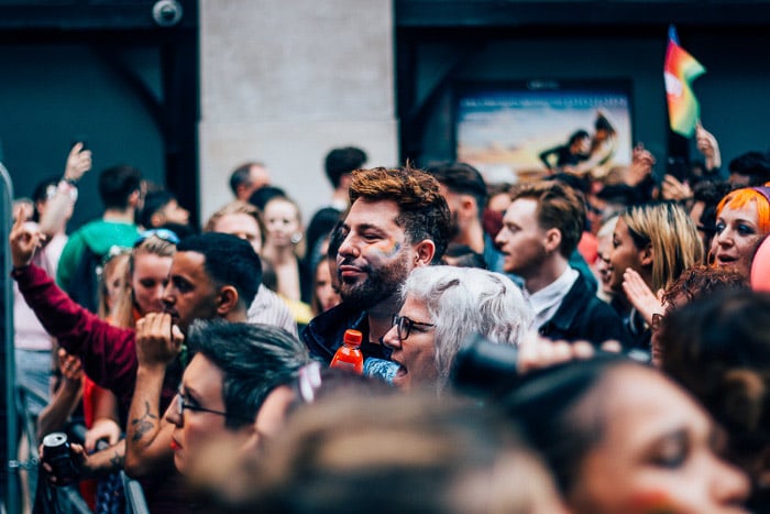 A candid shot of a crowd of people assembled
