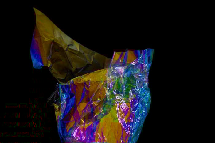 Food wrapper displaying abstract color effects from photoelasticity