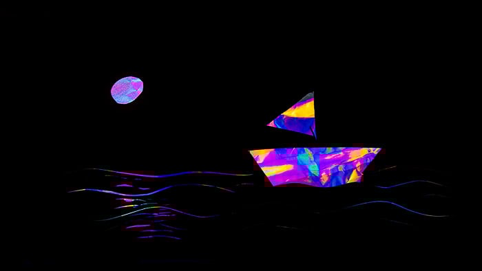 Rainbow effect photoelastic photography of a ship on a moonlit sea