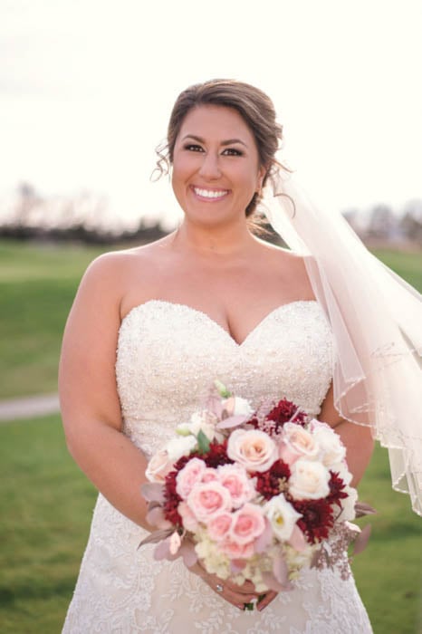 wedding portrait of a bride with reflectors used for lighting
