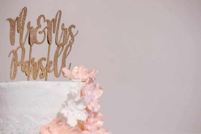 A close up of a Wedding Cake against a light background