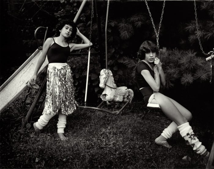 Portrait of kids on swings by Sally Mann