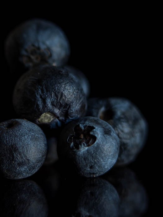 Black pepper in front of a black background