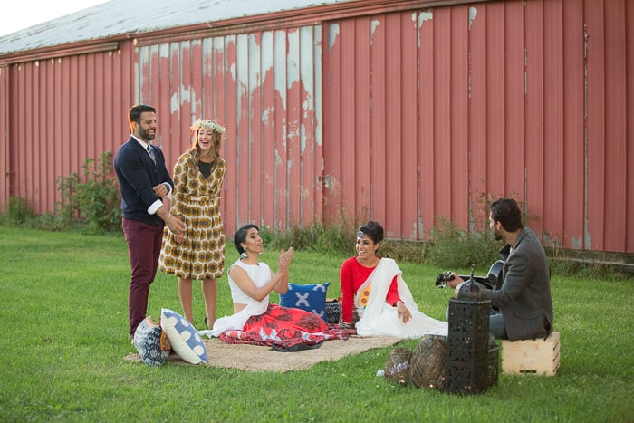 Outdoor fashion shoot involving a styled outdoor picnic with two men and three women in Indian-Fusion outfits and accessories.
