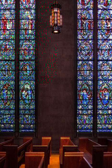 symmetry composition rule used in the photo of a chapel's stained glass windows
