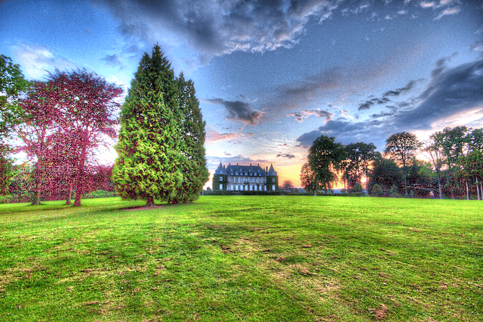 Bright over processed HDR landscape with a castle in the background.