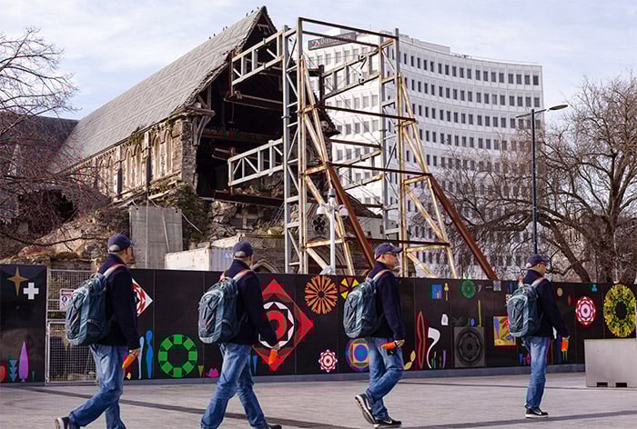A fun multiplicity photography example of four of the same man walking down a street