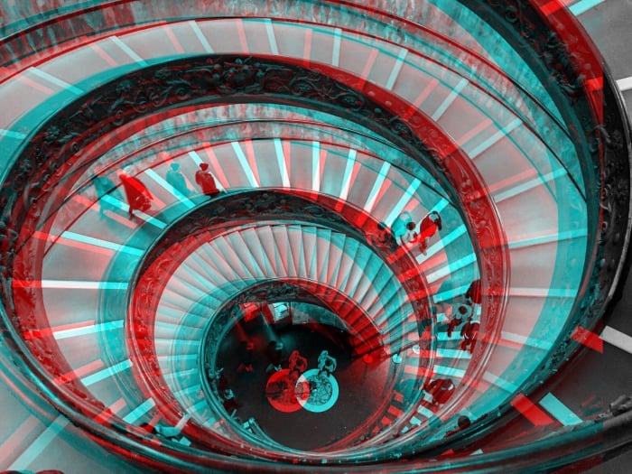 A spiral staircase edited with a glitch art effect 