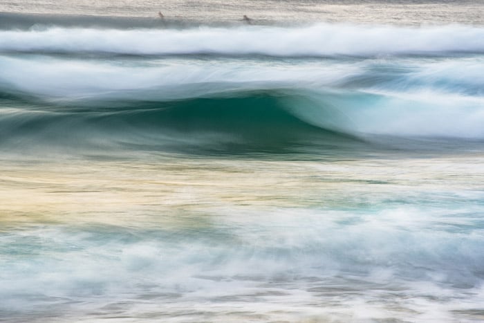 abstract seascape taken using long exposure ocean photography, blue green sea, foamy waves