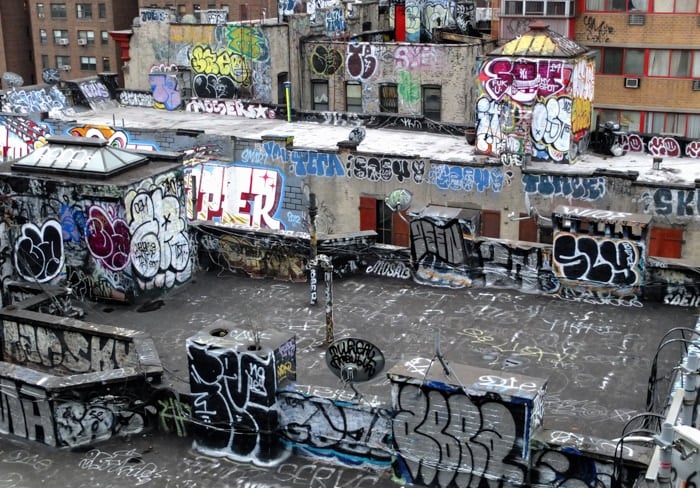 Aerial view of an abandoned industrial area covered with graffiti