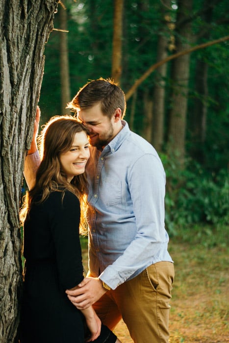 A couple kissing outdoors, shot using strobe photography