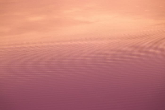 A red and orange colored abstract nature photography taking advantage of water