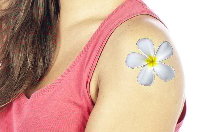 A portrait of a female model with a flower tattoo added using displacement maps in Photoshop