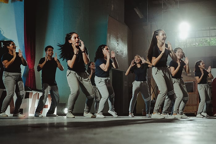 Multiple dancers on stage during a performance - dance event photography