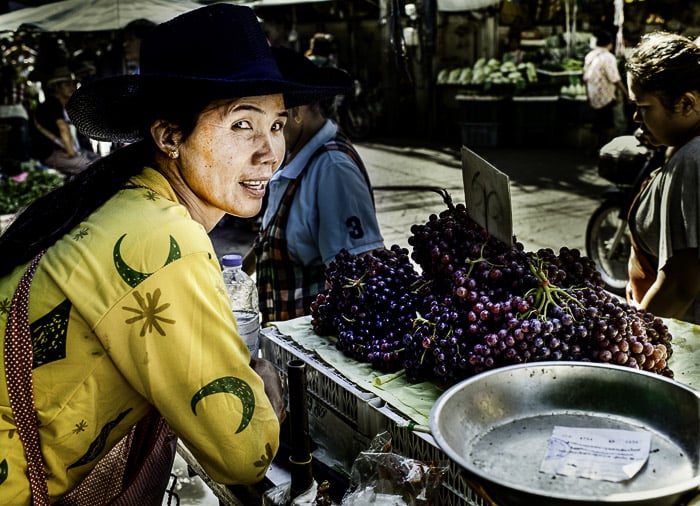 A street portrait of a market vendor