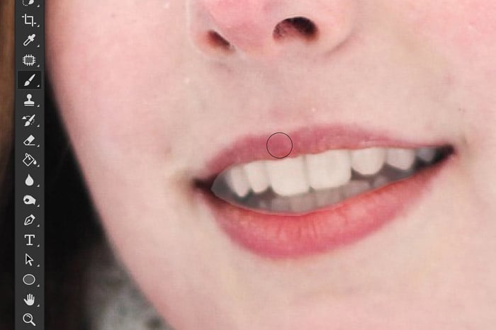 A screenshot showing how to whiten teeth in Photoshop with an adjustment layer