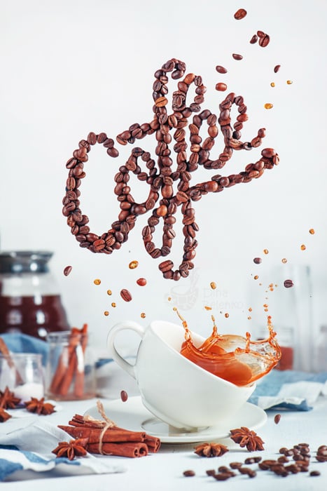 A creative still life using food typography made from coffee beans spelling 'coffee' - examples of typography