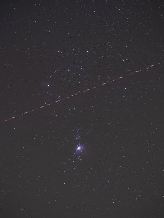 My M42 images was photobombed by a plane approaching Brussels International airport.