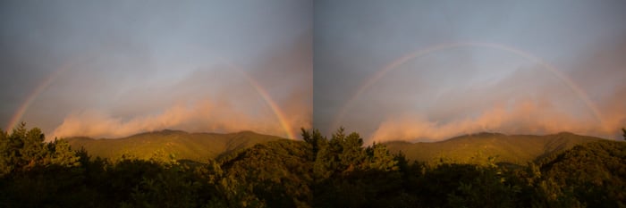 Part of a rainbow in front of an impressive landscape - pictures of rainbows