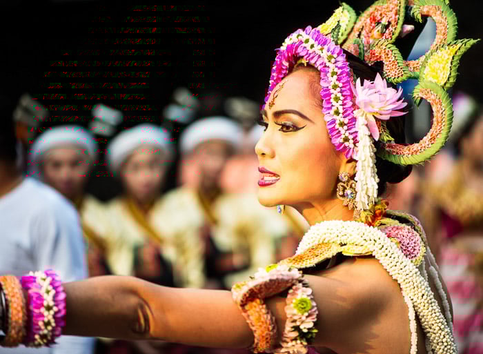 A narrative photography portrait of the director of a group of performers gives instructions before the start of the parade