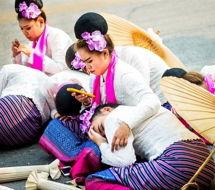 Performers who came early to prepare now rest before the parade commences. This provides an uncommon look at the parade. Narrative photography