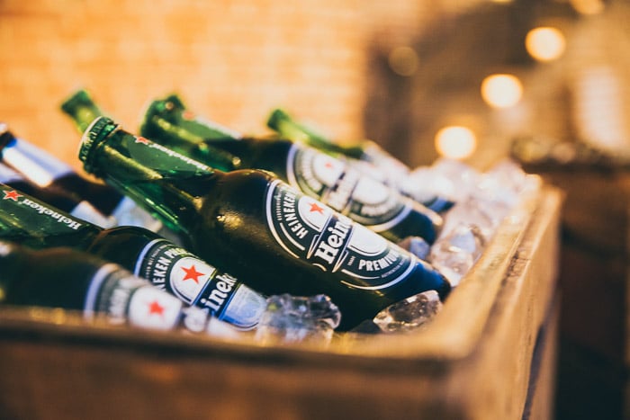 A crate of heineken bottles in ice - how to take beer pictures