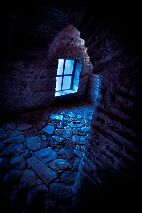 Atmospheric dark view of a stone arch - grunge photography tips