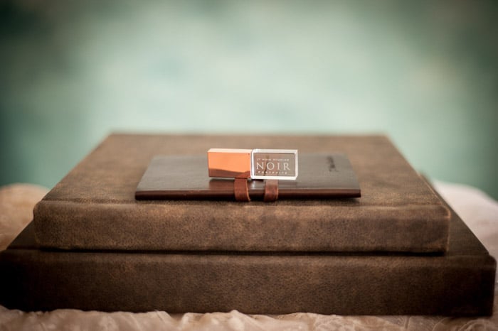 A product shot of a photo books with a marketing tag for how to become a boudoir photographer