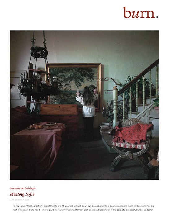 Environmental portrait of a child facing a painting in a house for Burn, one of the magazines looking for photo submissions