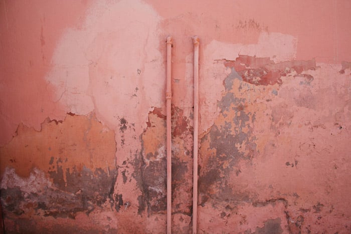 A dirty textured pink wall