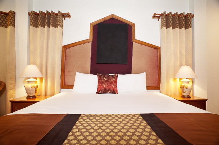 Interior of a luxury room at an Asian hotel shot with a One softbox and one reflector with a second flash bouncing off it.