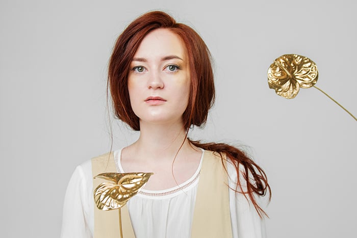 A studio portrait of a female model