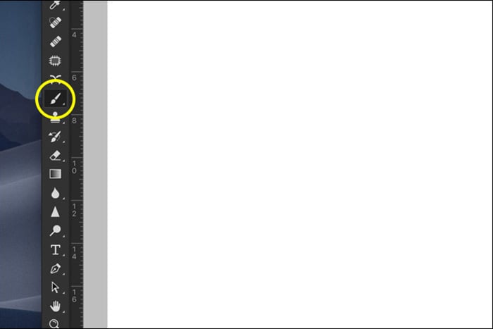 A screenshot showing how to click on brush tool in Photoshop