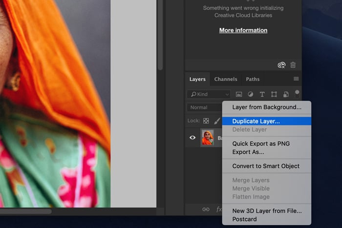 A screenshot showing how to duplicate the background layer in Photoshop