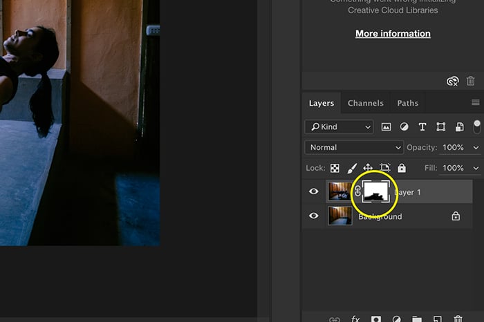 A Photoshop screenshot showing with the layer mask highlighted showing parts of the photo removed in black