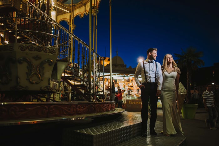 portrait of a couple at the fairground at night shot with the Profoto b10 flash