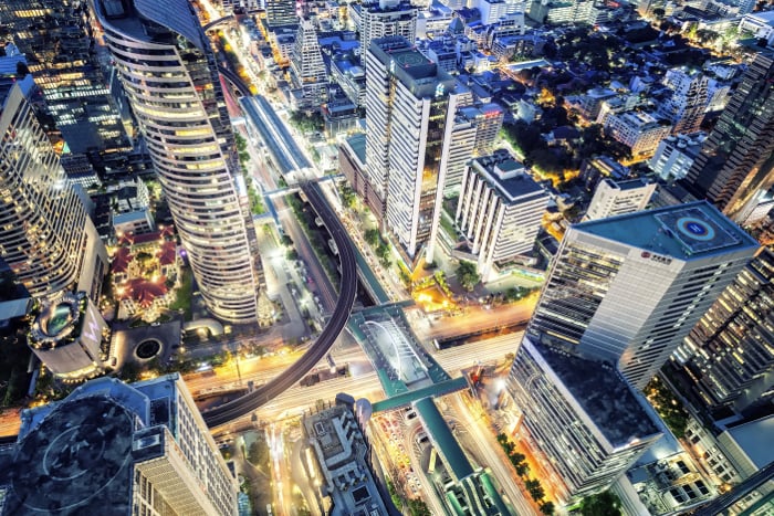 Night-time photo of an urban cityscape with skyscrapers from a birds-eye view