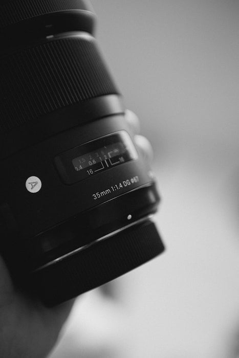 Photo by Isabella Mendes from Pexels Close-up of lens showing Sigma lens abbreviations