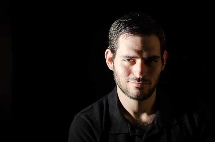 Portrait photo of a man in split lighting