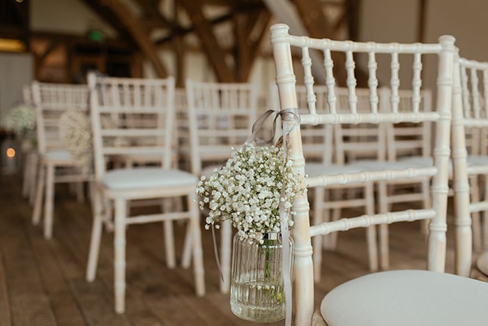 rows of empty chairs at an indoor event 