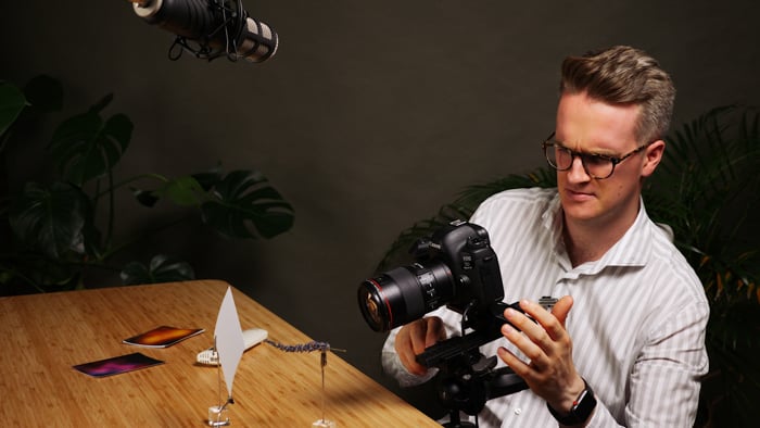 Photo of a man using a macro focusing rail
