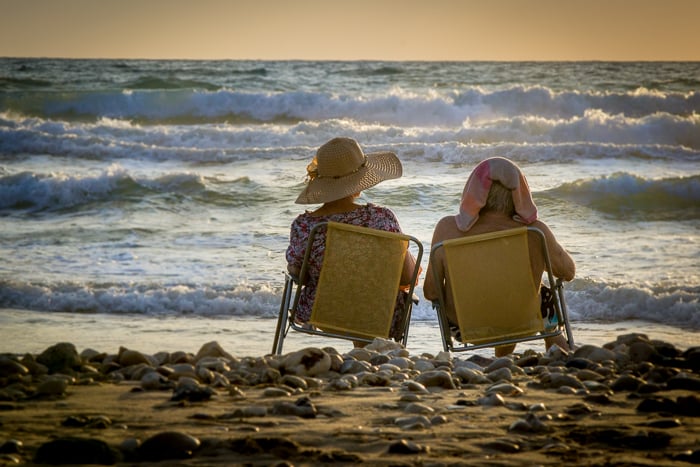 The same image of the elderly couple, zoomed in