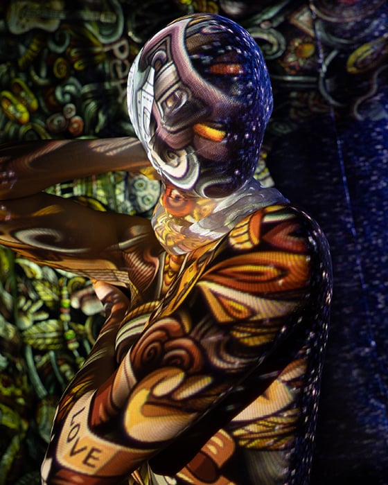 Stunning abstract portraits photography of a model's face wrapped in a piece of fabric that captures the patterns from two projectors