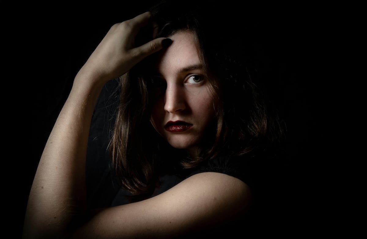 A sharp closeup studio portrait taken with a camera flash