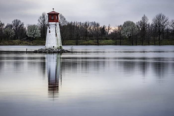 A little stone tower in a lake