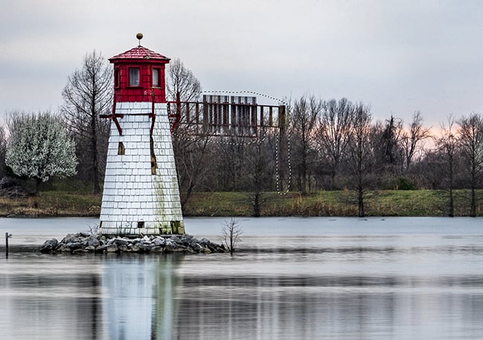 A small stone tower in a lake