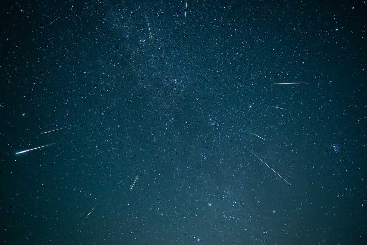 A night sky image of shooting stars in the Milky Way