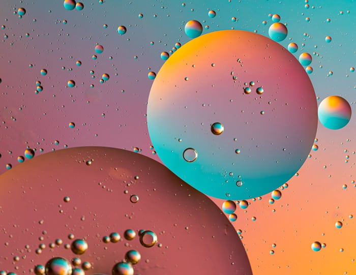 A colorful and bubbly microscopic view of soap bubbles.