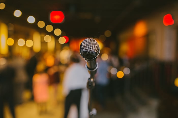 Bokeh lights behind a microphone.