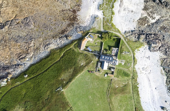 Aerial photo of a large house and surrounding nature